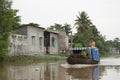 Vietnam man on a boat at Mekong River Royalty Free Stock Photo