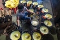 Vietnam man cooking Banh xeo sizzling cake, Vietnamese traditional street food yellow crispy rice flour cake Royalty Free Stock Photo