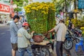 Vietnam, Nha Trang, January 23, 2020: Vietnamese men prepare to transport flowers for the Lunar New Year, Tet