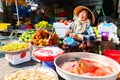 Vietnam, Phu Quoc Island, 26 February 2018: Smiling unidentified women with typical vietnamese conical hats sell fresh