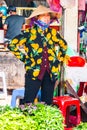 Vietnam, Phu Quoc Island, 26 February 2018: Unidentified women with typical vietnamese conical hats sell fresh food on a