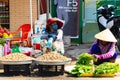 Vietnam, Phu Quoc Island, 26 February 2018: Unidentified women with typical vietnamese conical hats sell fresh food on a