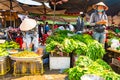 Vietnam, Phu Quoc Island, 26 February 2018: Unidentified women with typical vietnamese conical hats sell fresh food on a