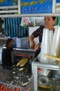 Lady making sugar cane drink, Ho Chi Min City, Vietnam 