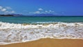 Vietnam. Summer. White lacy foam of waves lays beautifully on clean sand.