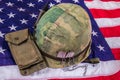 Vietnam Vet Helmet, Dog Tags & Ammo Pouch On American Flag