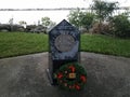 Vietnam veterans memorial with wreath and grass