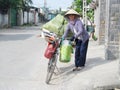 Vietnam woman with a bicycle Royalty Free Stock Photo