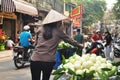 Vietnam woman people push bicycle cart hawker on road sale guava fruits to vietnamese people and foreign travelers on Hang Buom