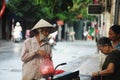 Vietnam woman people riding bicycle cart hawker on road sale local food goods to vietnamese people and foreign travelers on Hang