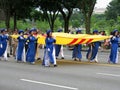 Vietnam Women Carrying Their Flag