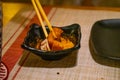 Vietnamese - Asian people eating sashimi set in Japanese restaurant. Hirame sashimi,salmon sashimi and tuna sashimi dish