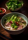 Vietnamese beef noodle soup with coriander and chili