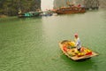 Vietnamese boat woman sells fruit