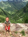 Vietnamese boy sit in front of famous travel destinations rice p