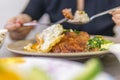 Vietnamese broken rice with grilled pork chop, fried egg and meatloaf Royalty Free Stock Photo