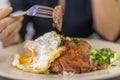 Vietnamese broken rice with grilled pork chop, fried egg and meatloaf Royalty Free Stock Photo