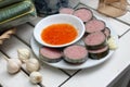 Vietnamese cinnamon rolls or pork sausag on white plate with gar Royalty Free Stock Photo