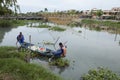 Vietnamese cleaners cleaning Hoai river from wastes