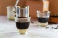 Vietnamese drip filter in glass on sweet condensed milk Royalty Free Stock Photo