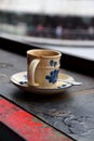 Pretty cup of coffee on balcony table