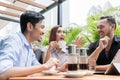 Vietnamese coffee served on the table of three friends outdoors