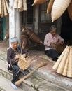 Vietnamese craftsmen making bamboo handicraft products