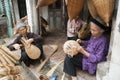 Vietnamese craftsmen making bamboo handicraft products