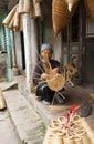 Vietnamese craftsmen making bamboo handicraft products
