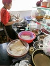 Vietnamese cuisine. Women cooking Beef Pho noodles