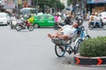 Vietnamese cyclo driver sleeps