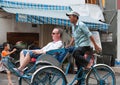 Vietnamese cyclo driver with tourist