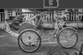 Ho Chi Minh City, Vietnam - September 1, 2018: Vietnamese cyclos and the shape of an undefined man in the back taking a break whil