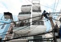 Vietnamese electricity worker climb high on electric post to repair electricity network