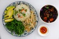 Vietnamese family meal for lunch with vegetarian food, vegetables, avocado with sauce, seaweed soup, vegan dish for dieting Royalty Free Stock Photo