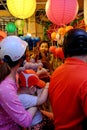 Vietnamese family on motorbike shopping mid autumn toy at night lantern street