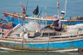 Vietnamese fisher untangles nets Royalty Free Stock Photo