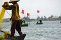 vietnamese fisherman fishing with net