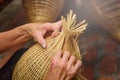 Vietnamese fishermen are doing basketry for fishing equipment at Royalty Free Stock Photo