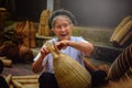 Vietnamese fishermen are doing basketry for fishing equipment at Royalty Free Stock Photo