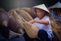 Vietnamese fishermen are doing basketry for fishing equipment at Royalty Free Stock Photo