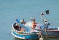 Vietnamese fishers untangle nets Royalty Free Stock Photo