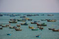 Vietnamese fishing village with traditional colorful fishing bo Royalty Free Stock Photo