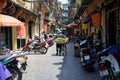 Vietnamese flower vendor with bicycle on the street of Hanoi Royalty Free Stock Photo