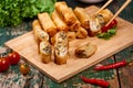 Vietnamese food. Delicious homemade spring rolls on wooden table