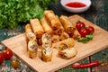 Vietnamese food. Delicious homemade spring rolls on wooden table