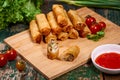 Vietnamese food. Delicious homemade spring rolls on wooden table