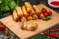 Vietnamese food. Delicious homemade spring rolls on wooden table