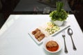 Vietnamese Food in Restaurant white plate the Table with side dish, Ingredients of Vietnamese Wraps or Pork Sausage, Nam Naung Royalty Free Stock Photo