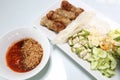 Vietnamese Food in Restaurant white plate on the Table with side dish, Ingredients of Vietnamese Wraps or Pork Sausage, Nam Naung Royalty Free Stock Photo